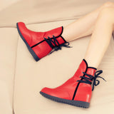 Stylish round-toe panels with solid color ties inside the heightened ladies booties